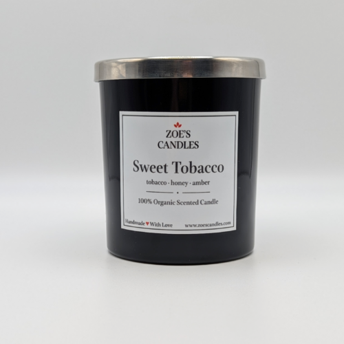 Sweet Tobacco Zoe's Candle in a black jar with a silver lid