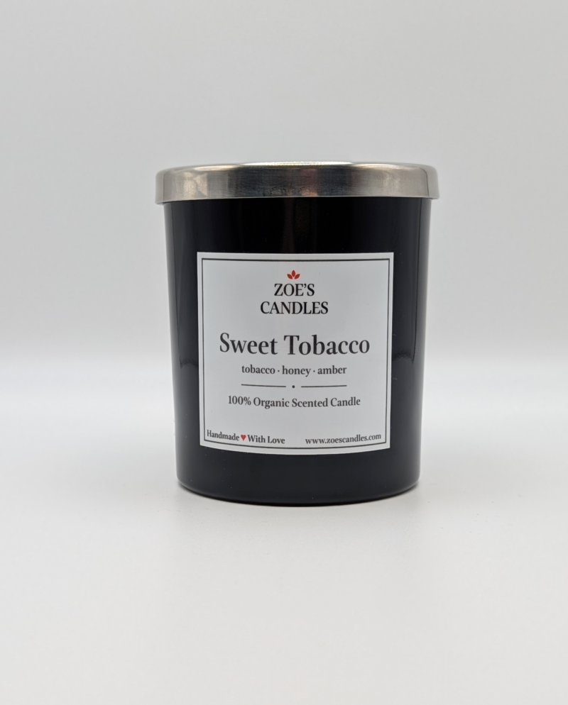 Sweet Tobacco Zoe's Candle in a black jar with a silver lid